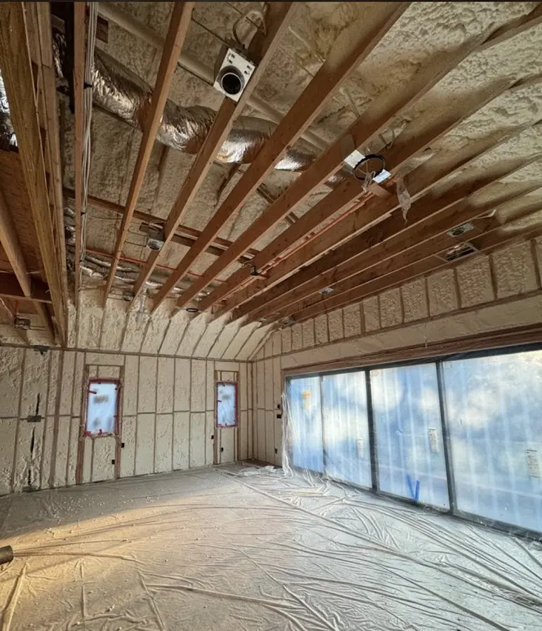 Interior walls and ceiling insulated with spray foam during new construction in Woodhaven